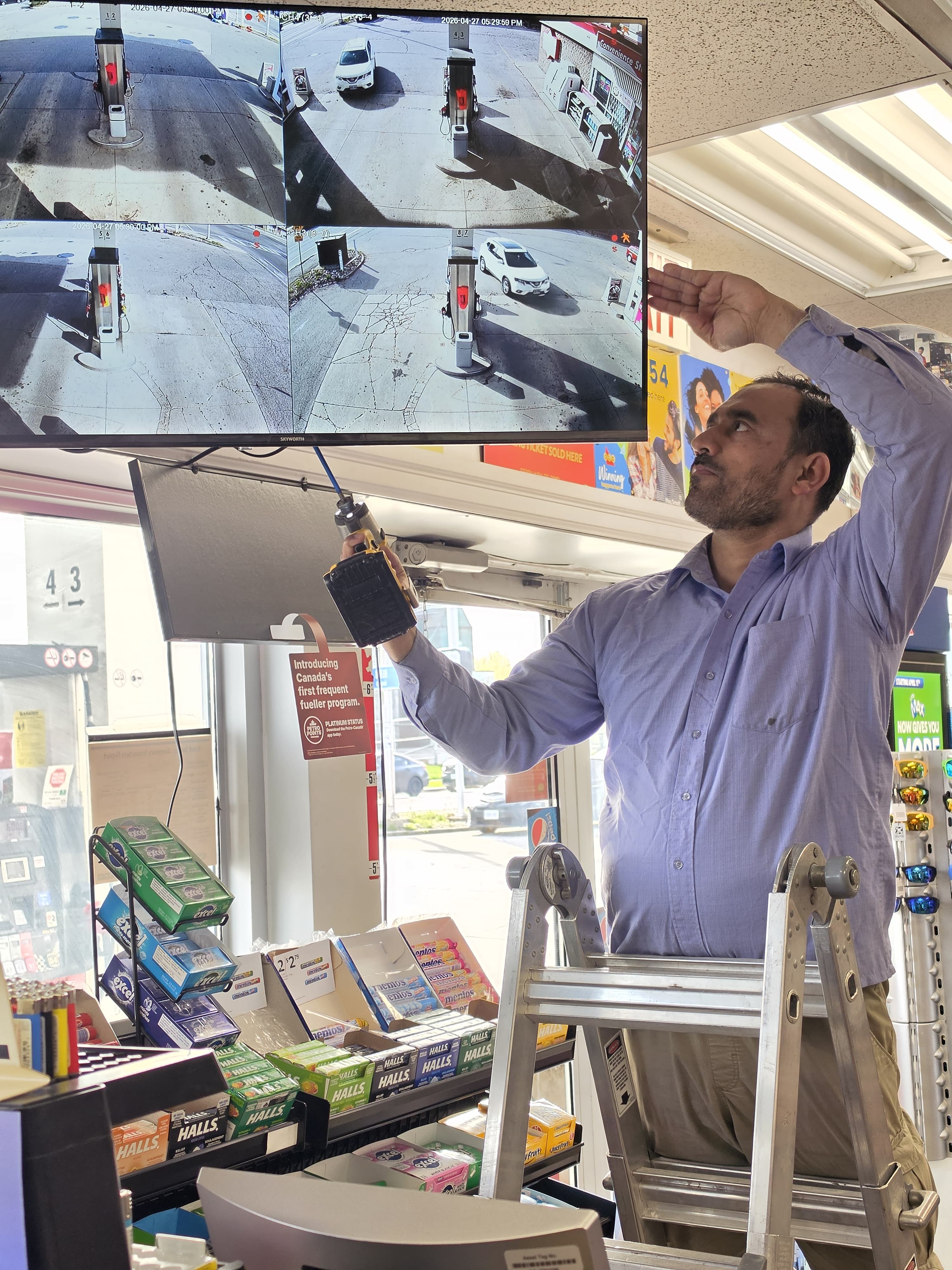 CCTV technician installing a security camera